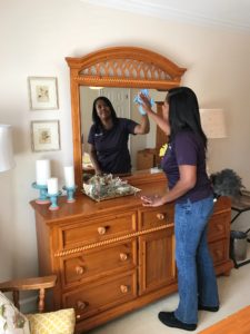 cleaning mirror and shelves